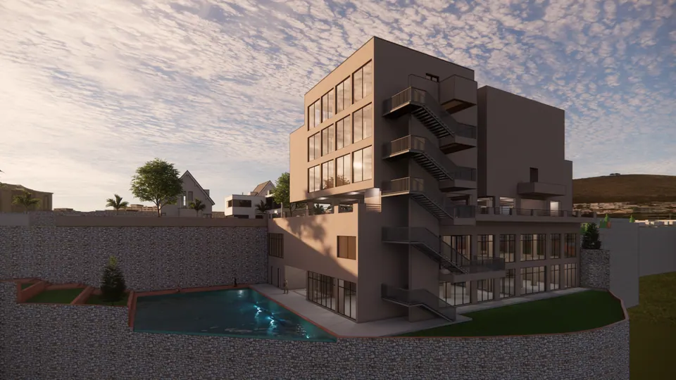 Rendered club house at dusk with glazed lower floors facing a pool, stone walls around the sunken garden