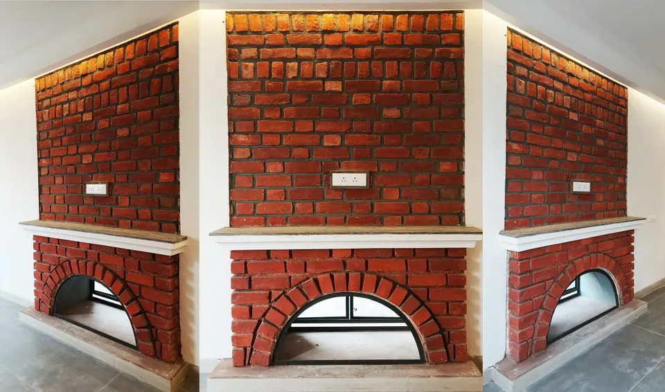 Brick chimney breast with arched fireplace openings and stone mantels, seen as a wide panorama